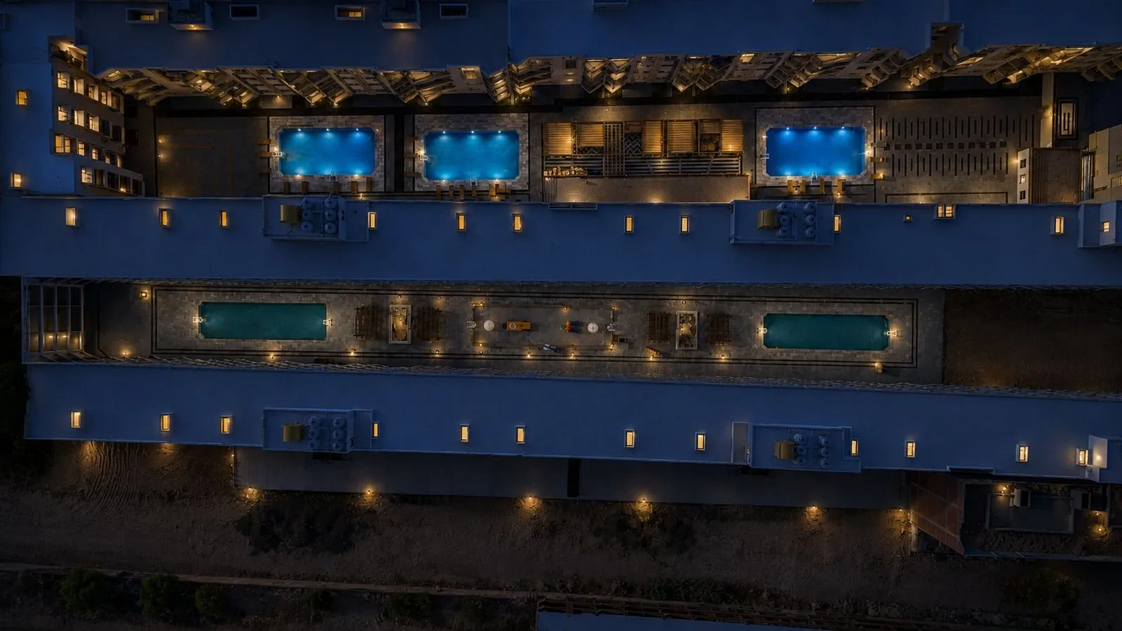 صورة من الموقع: Night aerial view of the courtyard pools, October 2026