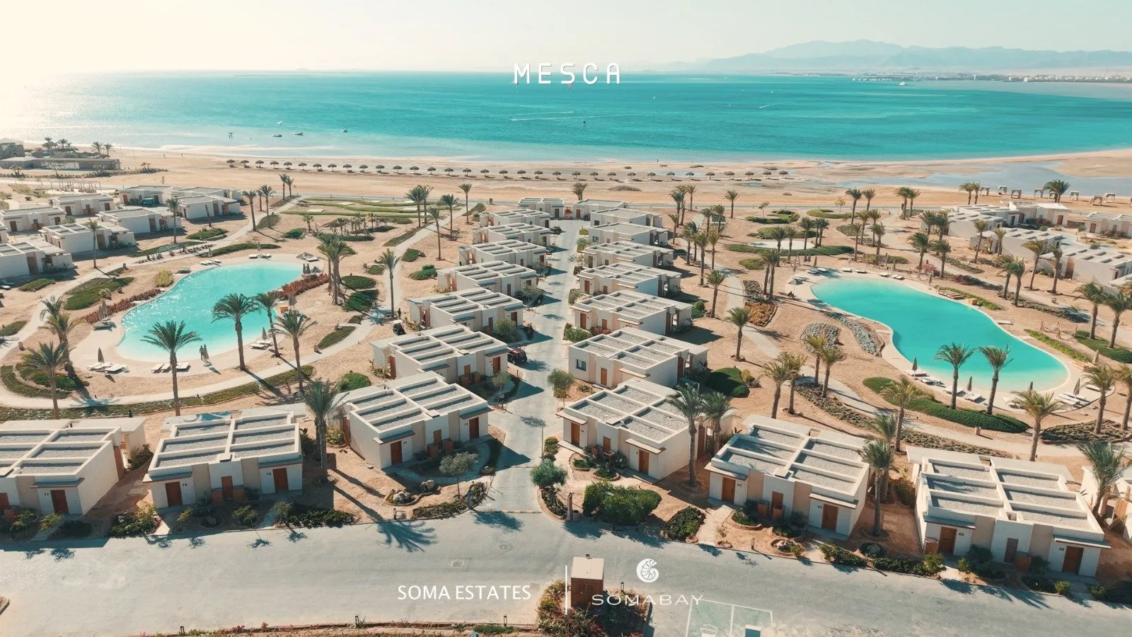 صورة حقيقية: Mesca buildings around the lagoon pools, aerial