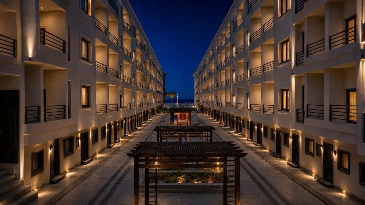 صورة حقيقية: Courtyard pergolas at night looking towards the promenade, October 2026